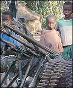 Children with artillery inside camp