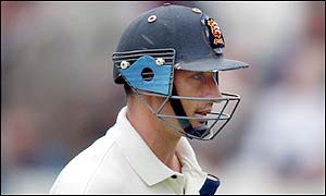 Nasser Hussain walks back to the pavilion after being caught behind