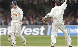 Warwickshire's Nick Knight leaves the crease after being caught by Andy Flower