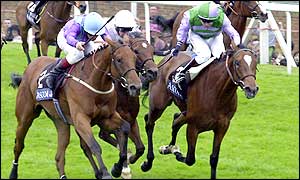 Richard Quinn rides Duty paid to victory in the Henry Carnavon Stakes, the first race of the day