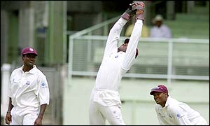 Windies wicket-keeper Ridley Jacobs hangs on to a high ball behind the stumps