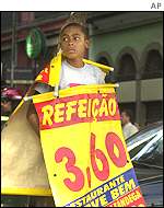 Young boy carries sale advertisement