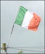Irish Tricolour flying from electricity pole