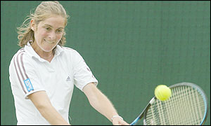 The strain is apparent on the face Hannah Collin as she hits a backhand to her opponent