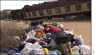 Passenger's luggage in front of carriages
