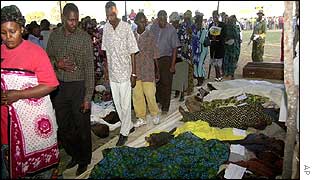 Relatives examine dead bodies