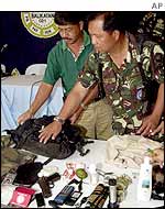 Military displays the contents of a backpack believed to be Abu Sabaya's