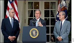 President Bush delivering Monday's speech, with Secretary of State Powell and Defence Secretary Rumsfeld