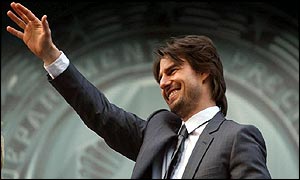 Tom Cruise waves to the crowd in Leicester Square