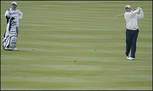 Lee Westwood of England on his approach to the 16th