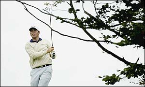 England's Nick Dougherty's plays a shot on the ninth hole
