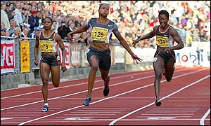 America's three-times Olympic champion Marion Jones coasts home to win the 100m from Tanya Lawrence and Chryste Gaines 