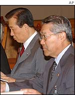 President Kim of South Korea (left)