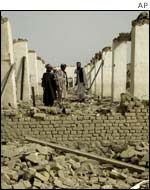 Afghans at a destroyed mosque