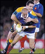 Australia hooker Brendan Cannon wraps up French scrum-half Frederic Michalak