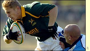 Argentina tackle South African fullback Brent Russell