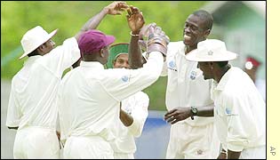 The West Indies celebrate after taking the wicket of Craig McMillan