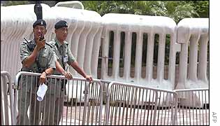 Hong Kong policemen in position at a roadblock in the Wanchai area of Hong Kong 