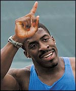 Dwain Chambers points to the sky after beating Maurice Greene for the second time in a week