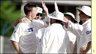 New Zealnd celebrate as Chris Gayle eventually falls to the bowling of the impressive Shane Bond