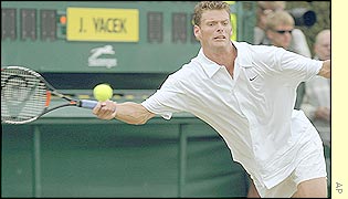 Sjeng Schalken stretches for the match winning point 