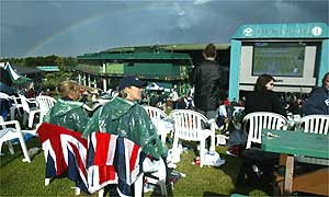 Rain suspends play for the first time this year at Wimbledon