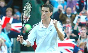 Henman celebrates victory after five sets