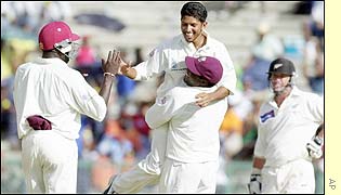 Ramnaresh Sarwan is congratulated by team-mates after claiming the wicket of Lou Vincent 