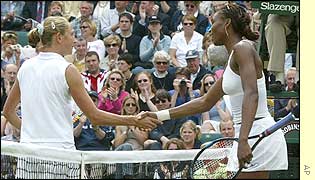Williams commiserates her opponent at the end of the match with the usual handshake at the net 