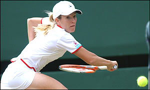 Justine Henin plays a backhand