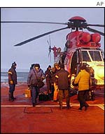 11 Russian scientists disembarking from an Oryx helicopter on the landing deck of the S A Agulhas - 27 June