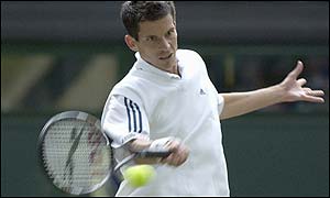 Tim Henman powers a forehand back to Andre Sa during the opening game of the match