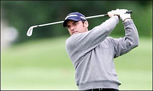 McGinley briefly found level par but finished the day on five over