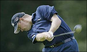 Westwood struggles for his par on the long 10th, then pays for a ragged approach to the 11th