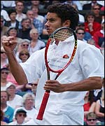 Andre Sa celebrates taking the second set against Tim Henman