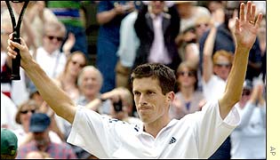Henman takes the applause of the crowd after clinching victory