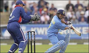 Sachin Tendulkar plays the ball to the boundary past England wicket-keeper Alec Stewart