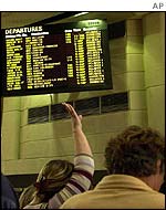 Departure board showing delays at Los Angeles International airport