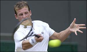 Nalbandian plays a powerful forehand and manages to hold his nerve to take the second set 6-4