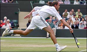 Xavier Malisse stretches for the ball at the net 