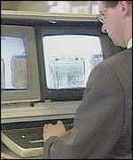 Security official checking baggage x-rays