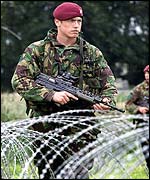 Troops have rolled out the barbed wire in readiness