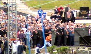 A small crowd of protesters hurled missiles at riot police