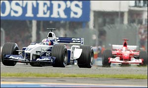 Juan Pablo Montoya held off the Ferrari challenge of Michael Schumacher until lap 16