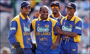 Sri Lanka's captain Sanath Jayasuriya is congratulated by team-mates after bowling Andrew Flintoff