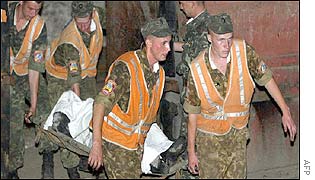 A miner's body is carried out of a Donetsk pit two weeks ago