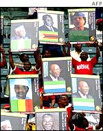 South Africans carrying posters of African leaders in Durban