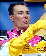Erik Zabel puts on the yellow jersey