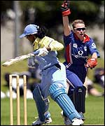 Mandie Godliman of England celebrates as India's Mamtha Maben is bowled 