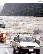 A road is washed out by floods in Gifu city, Japan